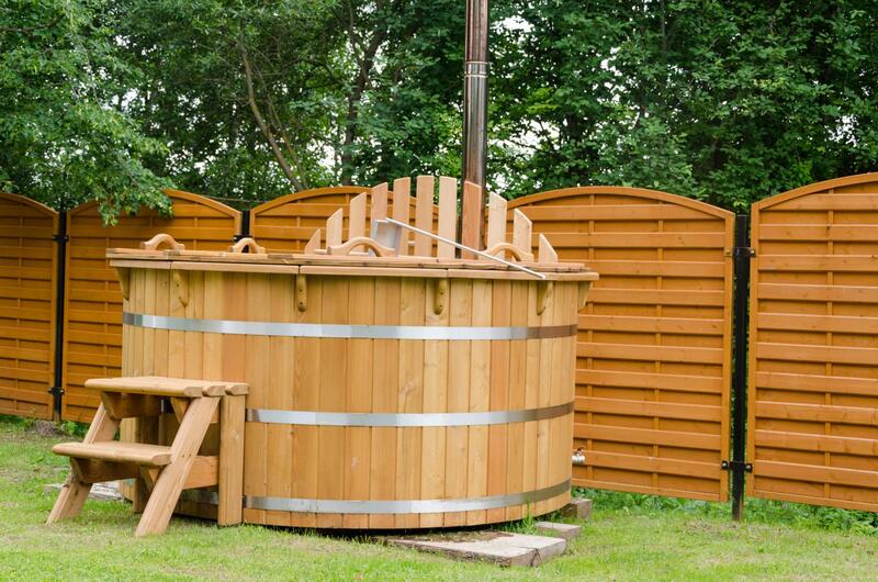 a wooden jaccuzi at the backyard